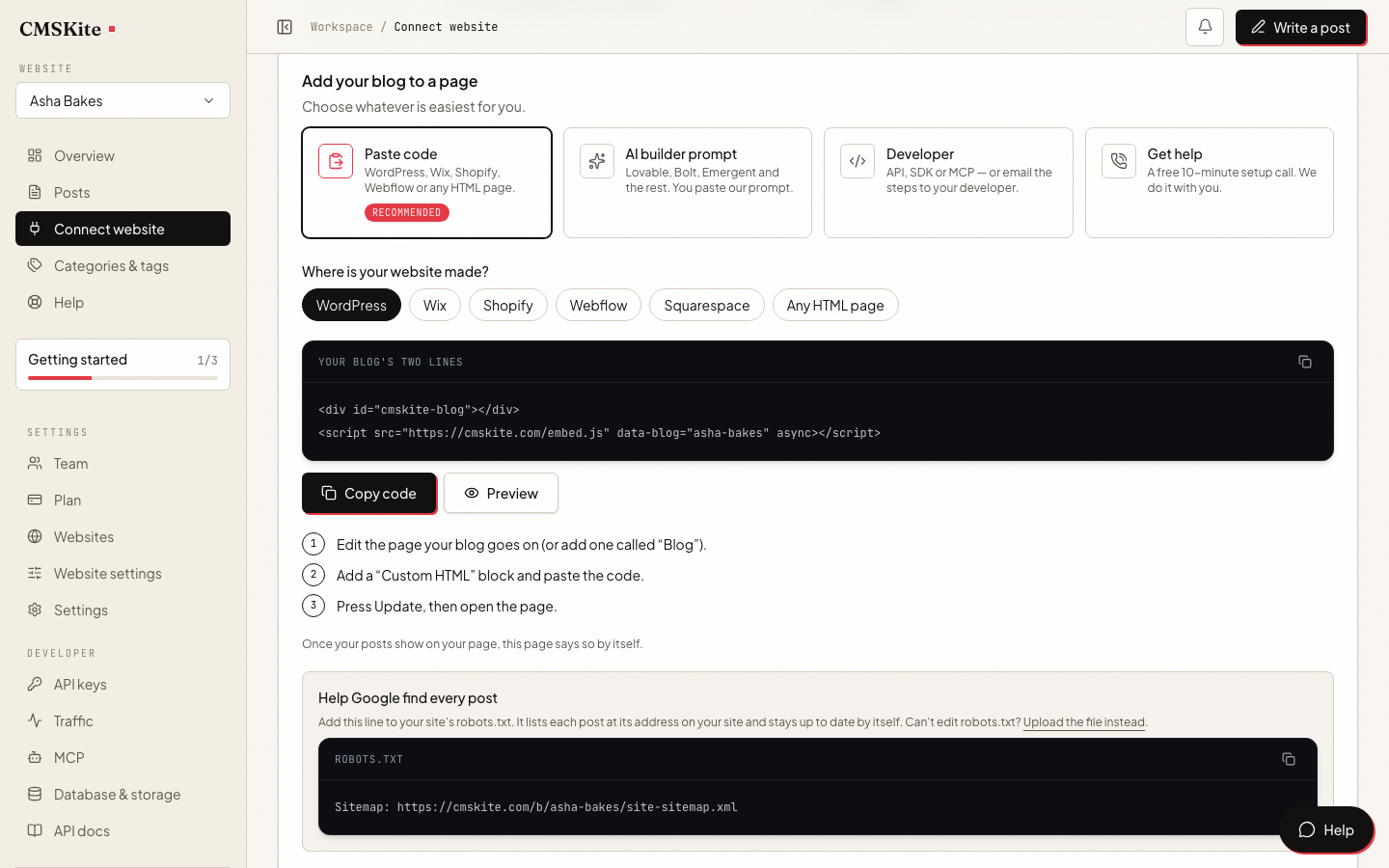 The Connect your website page in the CMSKite dashboard, with the two lines of code ready to copy.